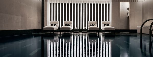 Indoor pool with loungers at the Aman Spa.