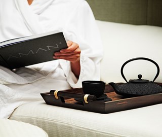 View the relaxed atmosphere with tea and reading a book at Aman Spa by The Connaught.